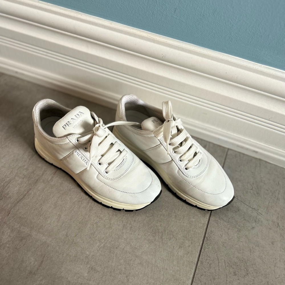 beautiful, comfortable white leather Prada sneakers.